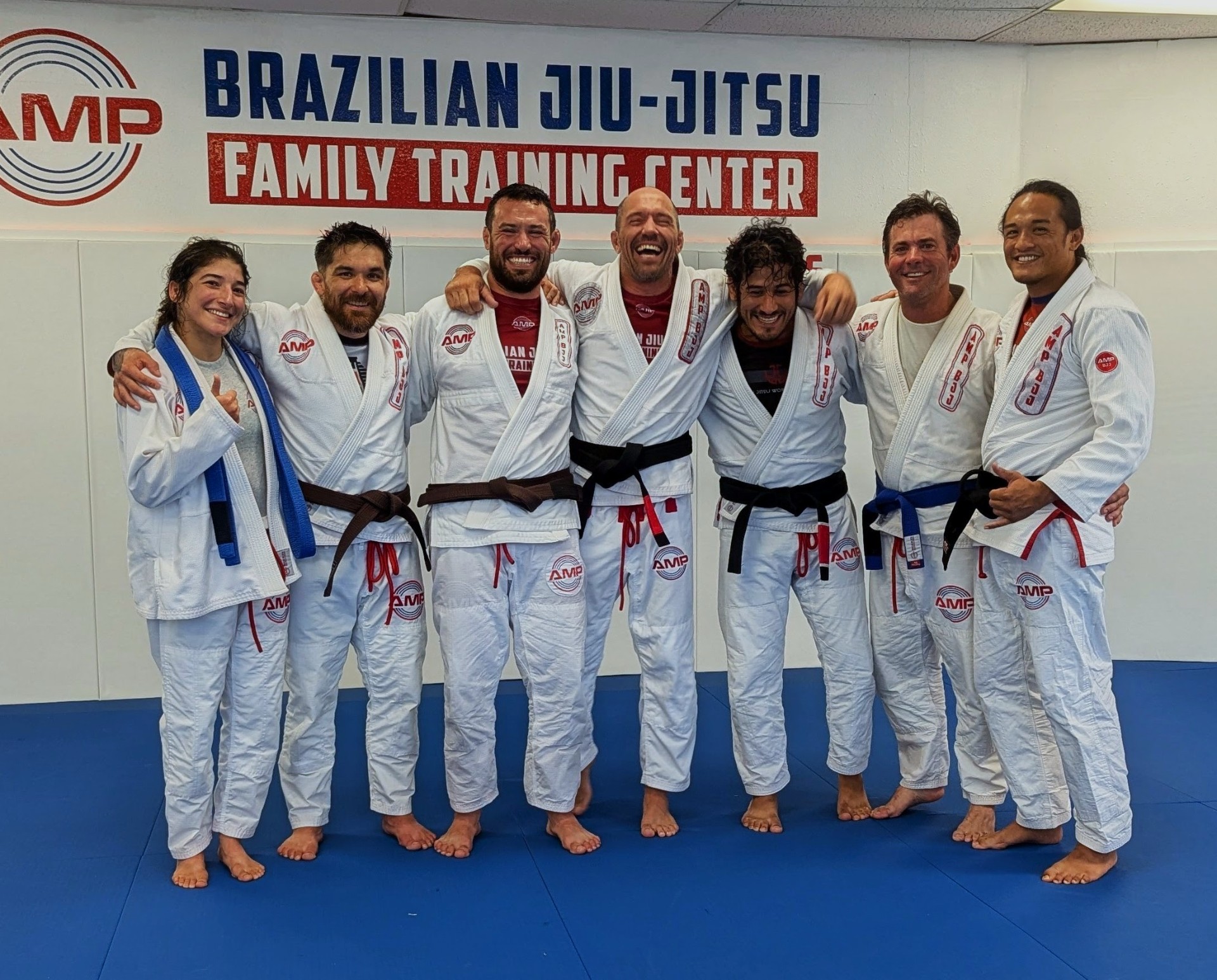 AMP BJJ team gathered together on the mats