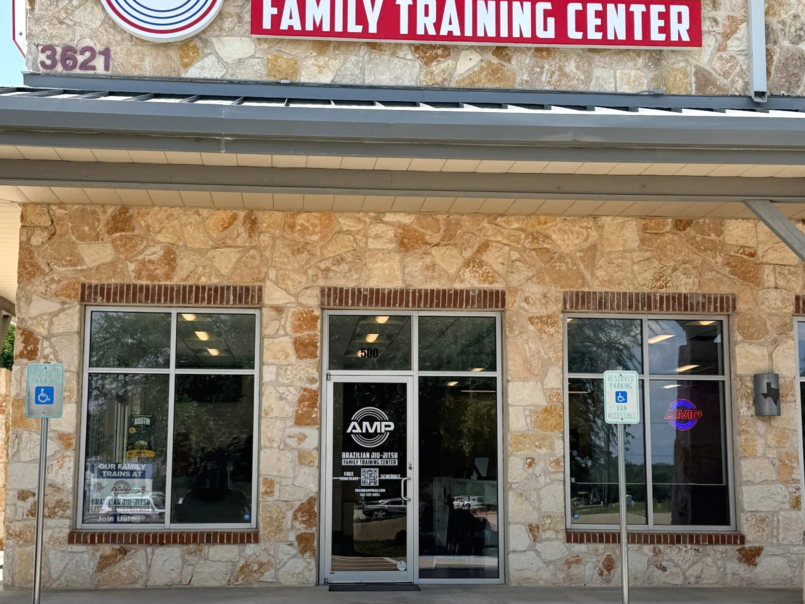 AMP BJJ Cedar Park — 3621 E Whitestone Blvd, Ste 500 AMP BJJ Cedar Park storefront on Whitestone Blvd — Brazilian Jiu-Jitsu Family Training Center with red AMP logo on Texas limestone